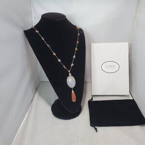 Ali Khan Pendant necklace with a long chain. faceted glass bead